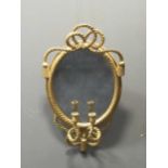 A 19th century gilt wood rope twist girandole mirror, the oval plate within a moulded rope twist