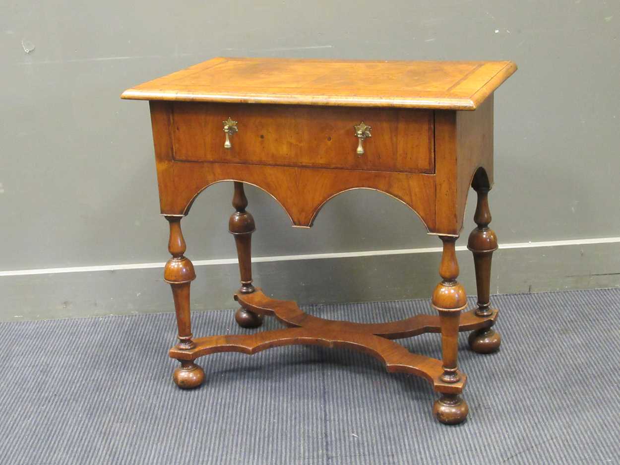 A William & Mary style walnut low boy with single drawer on turned legs and flat X-shape