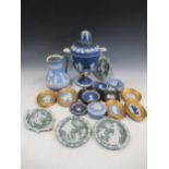 A collection of Wedgwood jasperware plaques; together with a two handled urn 33cm, and jug and