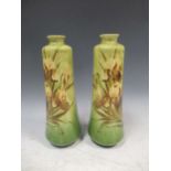 A pair of Art Nouveau painted green vases 27cm high (2)