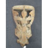 An early 20th century Burmese carved wood corbel, modelled as deity 64cm high