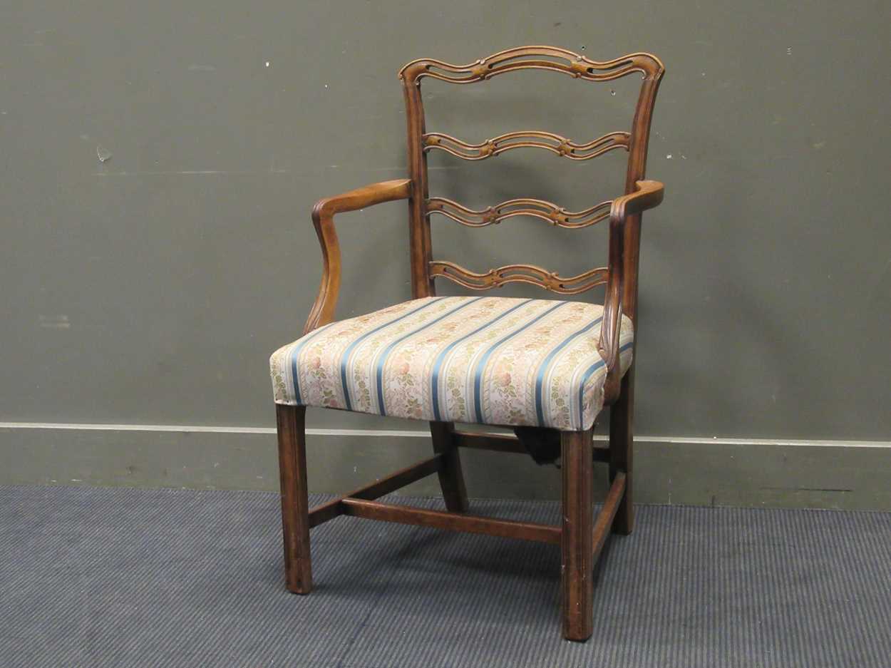 A 19th century mahogany pierced ladder back open armchair