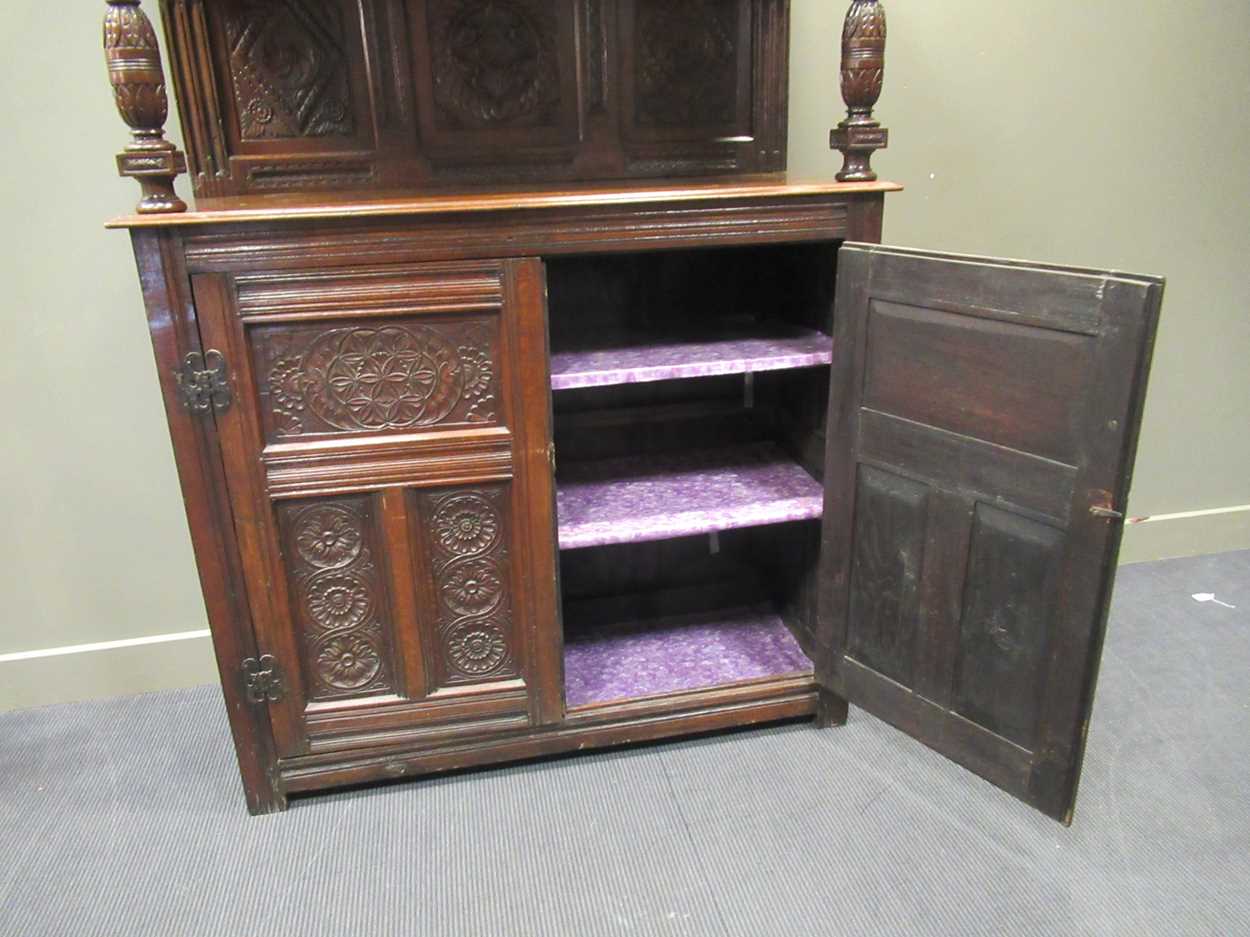 A carved oak court cupboard, 19th century, 189 x 140 x 56cmProperty from Blomvyle Hall - Image 4 of 6