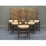 A set of six beech wood and rush ladderback chairs