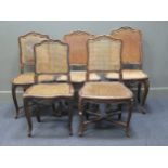 A match set of five French Louis XV style carved frame caned chairs