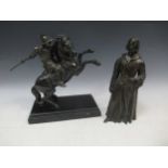 A bronzed figure of a Catholic monk, 28cm high; together with a bronzed model of knight riding a
