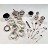 A collection of silver cruets and spoons together with silver napkin rings 14.1ozt gross