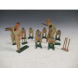 An English transfer printed wooden cricket figures, the bowler and batsman with hinged arms and