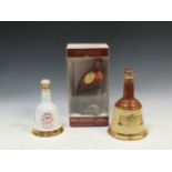 A Royal Doulton Whyte & Mackay Golden Eagle whiskey decanter (boxed), together with a Bells