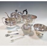 A small collection of silver including a teapot, sugar bowl, sugar nips and two silver bowls,