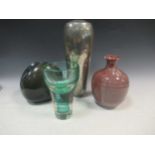 A green glass vase with a red spiral, 20cm high; an American purple vase, 20cm high; a Rosenthal