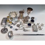 four silver and enamel egg cups, a silver punch ladle, a silver and mother of pearl rattle a