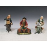 A group of Doulton figures to include 'In the Stocks' HN2163 15cm high, The Tinsmith HN2146 16cm