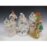 A group of figural ceramics to include a pair of Staffordshire figures Boot Shine and Paper Boy