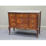 A French transitional style kingwood commode, 19th century, the shaped grey marble top over three