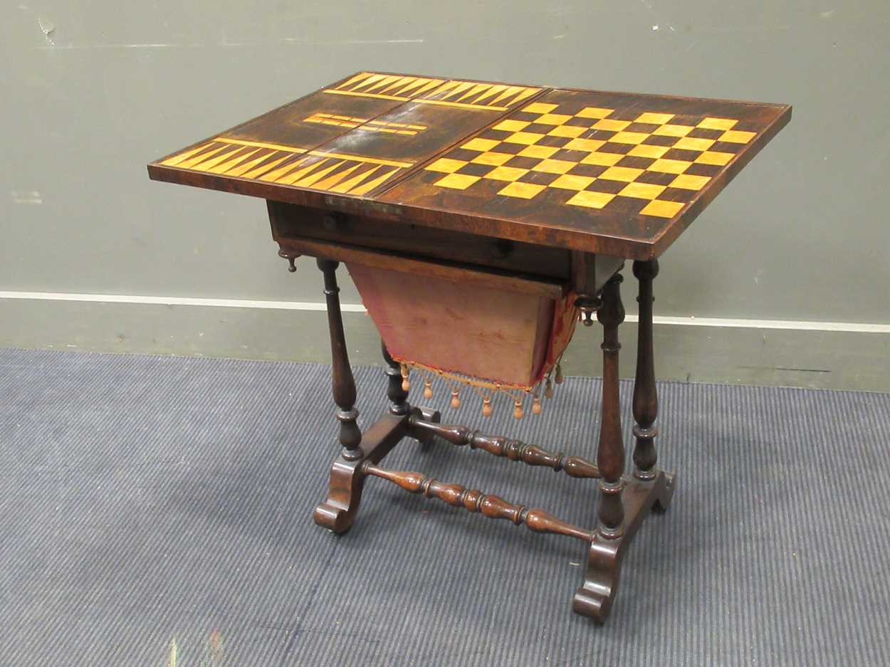 A 19th century inlaid rosewood games table, the fold over swivel top enclosing an inlaid - Image 5 of 10