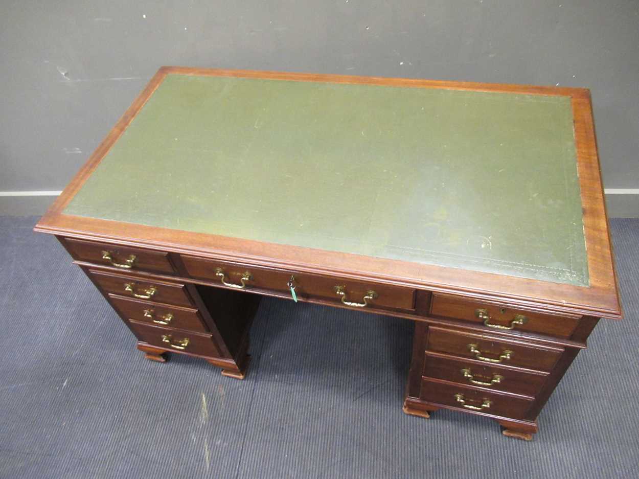 A George III style mahogany pedestal desk comprising of nine drawers on ogee bracket feet, 78 x - Image 4 of 5