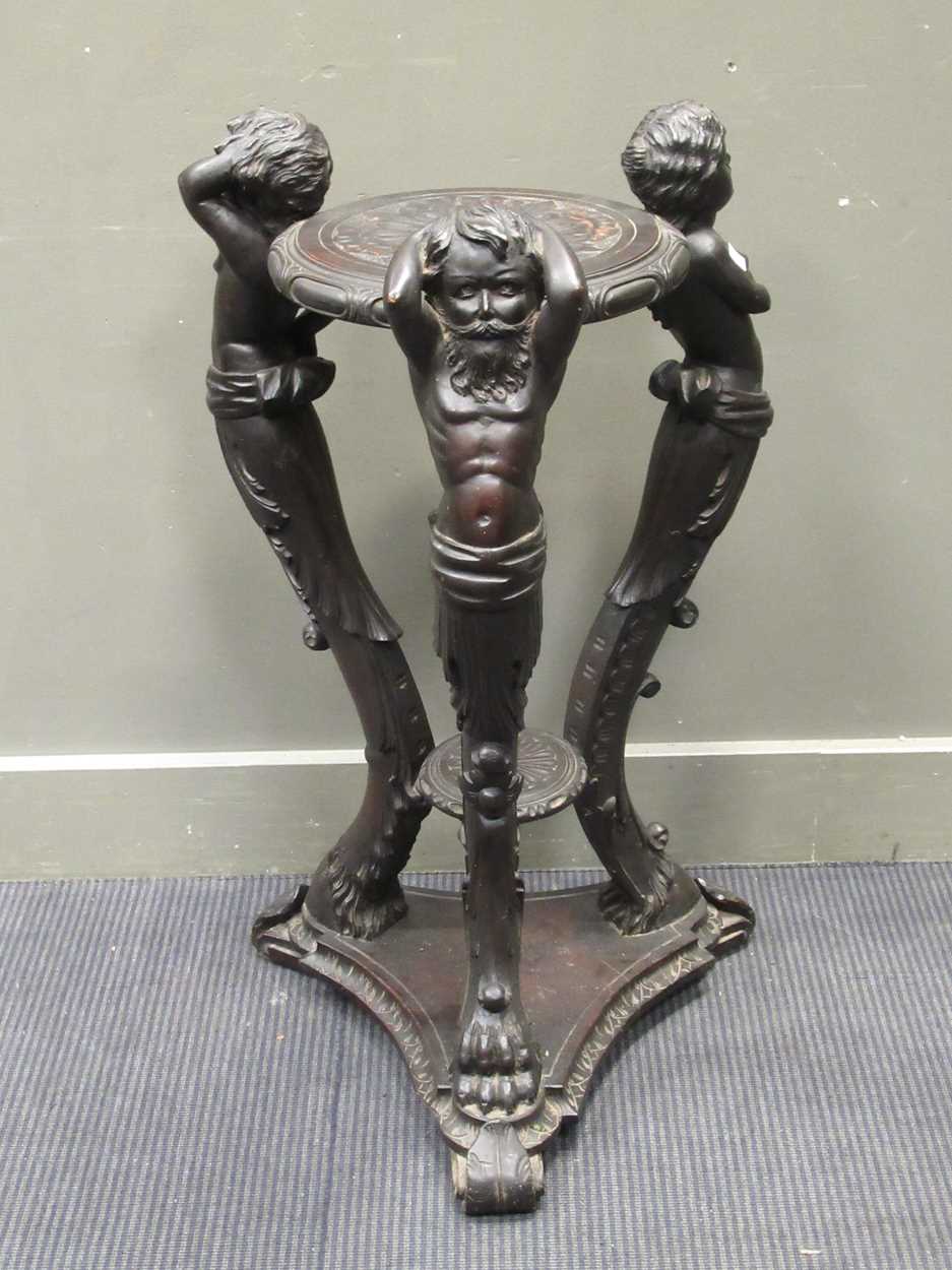 A late 19th/ early 20th century carved wood jardinere stand, the circular top with central rosette