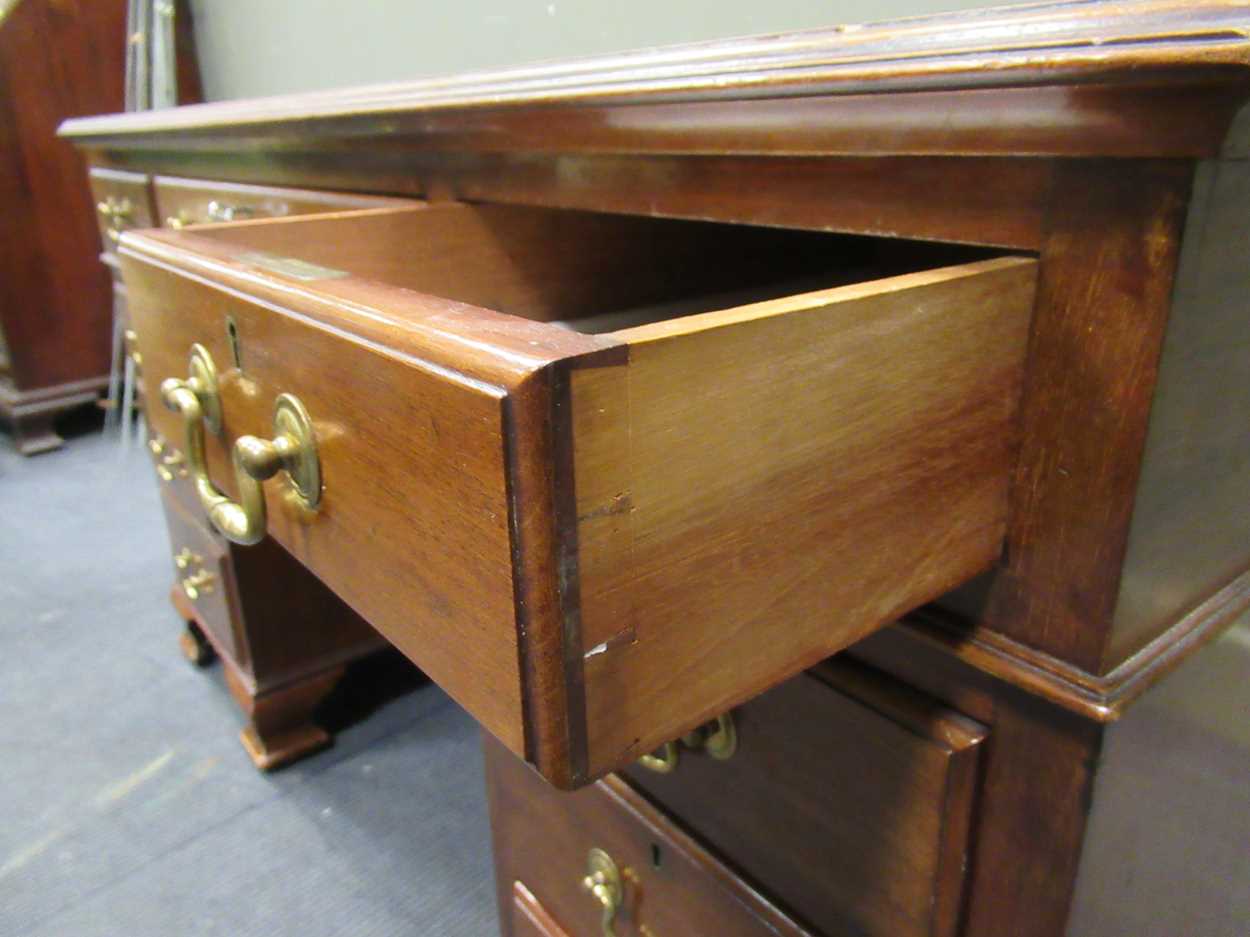 A George III style mahogany pedestal desk comprising of nine drawers on ogee bracket feet, 78 x - Image 2 of 5