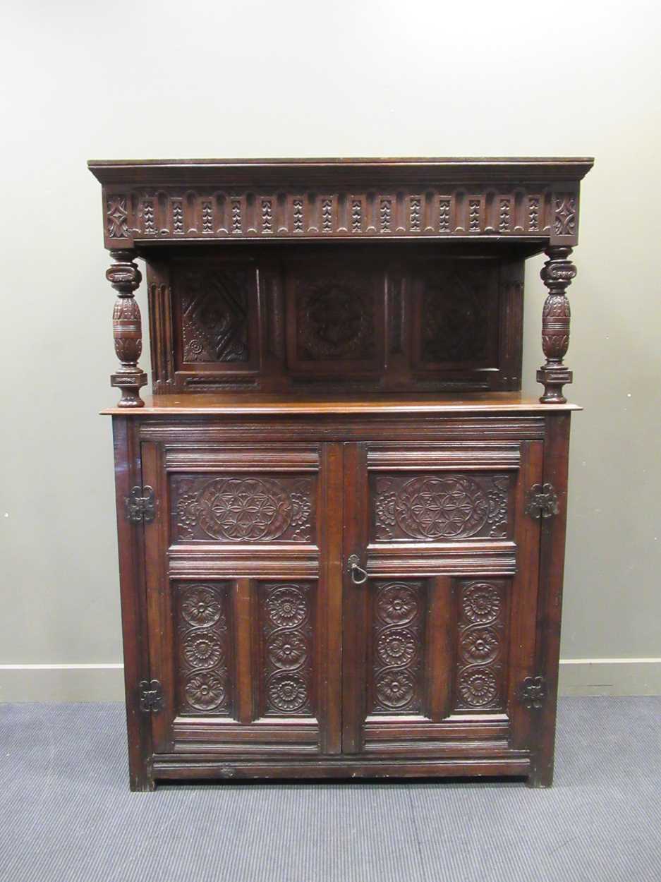 A carved oak court cupboard, 19th century, 189 x 140 x 56cmProperty from Blomvyle Hall