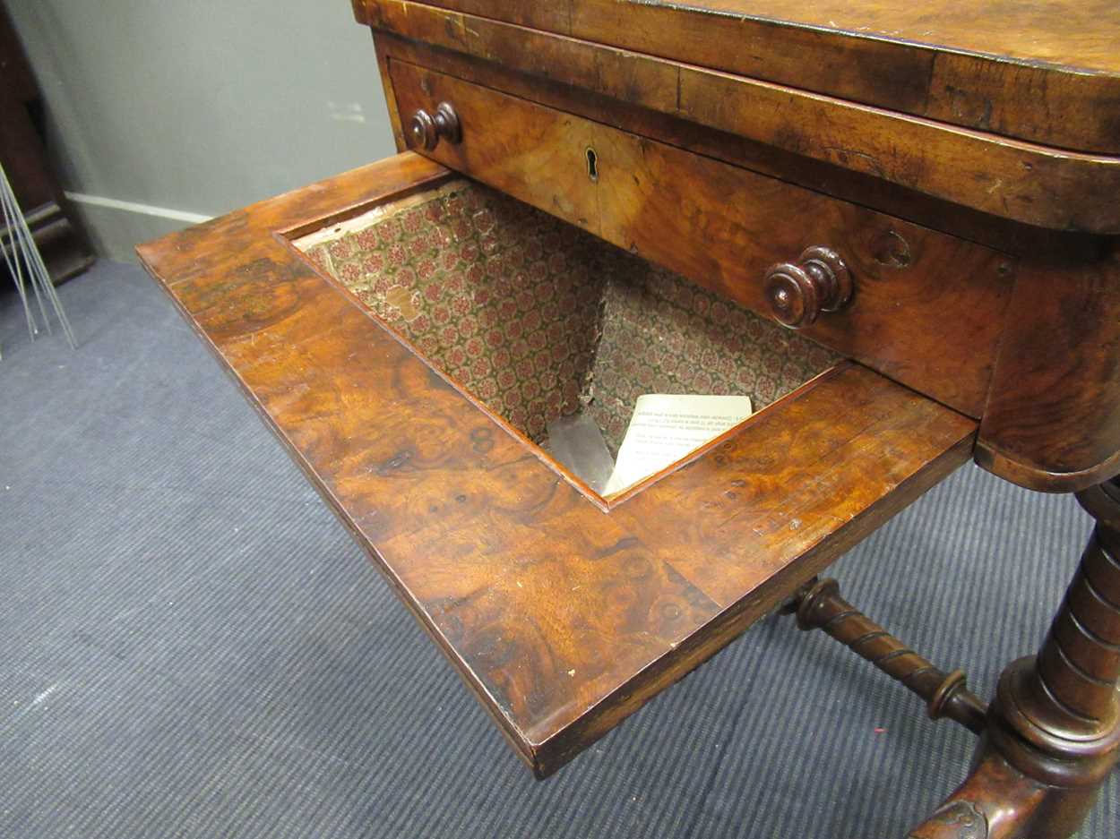 A Victorian walnut inlaid fold over games table, the fold over top enclosing an inlaid backgammon - Image 6 of 7