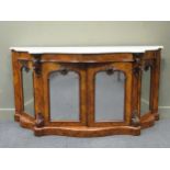 A Victorian burr-walnut marble topped credenza, of serpentine form with four arched mirrored doors
