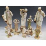 A collection of Royal Worcester figures, including figures with classical urns pouring water, a