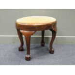 A George II style oval mahogany frame stool with drop in seat on ball and claw feet, 53 x 60 x 45cm