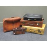 Four leather suitcases, a pigskin case with a pair of treen bowls and an Easiwork, London