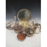 A large quantity of silver plated ware to include candlesticks, trays, bottle coasters, flatware