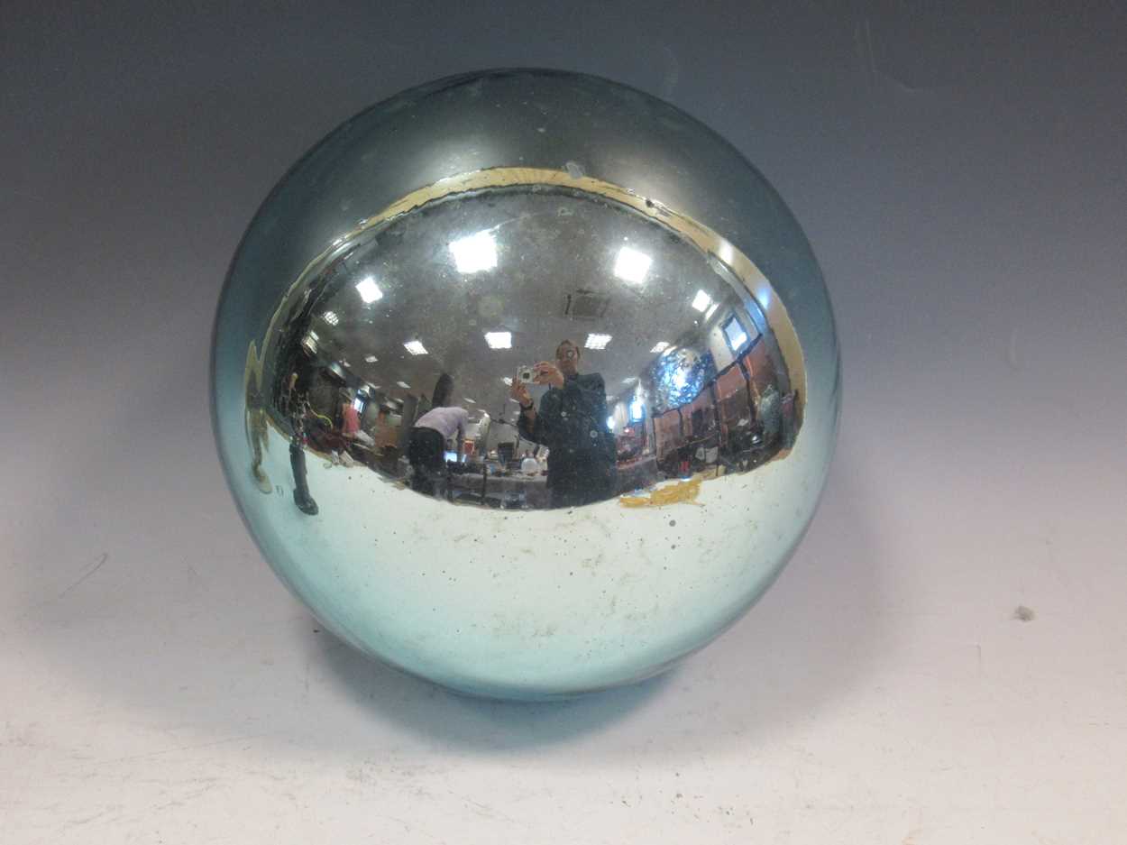 A large aquamarine coloured witch's ball, 25cm diameterThe glass has degraded somewhat, especially