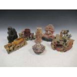 A group of carved soapstone items to include vases, flowers and animal figures (8)