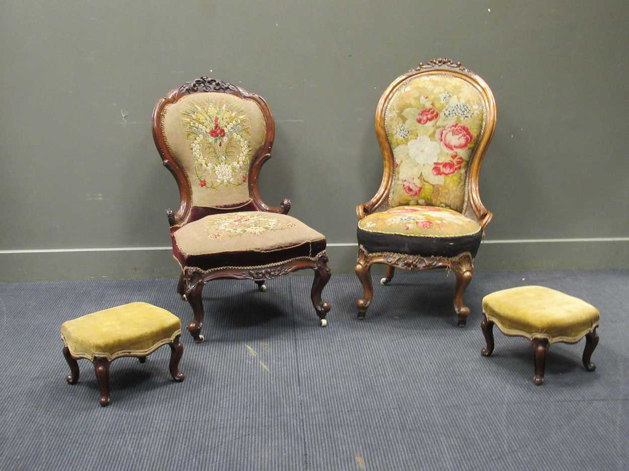 Two similar Victorian carved walnut spoon back chairs on cabriole front legs and ceramic castors and