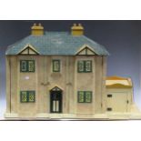 A circa 1940's dolls house with opening front, tin frame windows and some furniture, 66 x 103 x