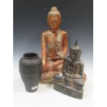 An Oriental cast iron oviod vase, in archaic style,
