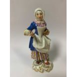 Meissen figurine of a lady, early 20th century, 14cm high, damage to the apron