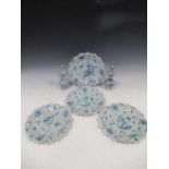 Four pierced Italian Cantagalli blue and white plates decorated with putti and floral sprigs, 24cm