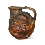 Robert Wallace Martin for Martin Brothers, a stoneware face jug, 1899,