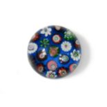 A small Clichy spaced millefiori glass paperweight,