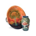 A Moorcroft Eventide pattern tazza and a small Claremont pattern vase,