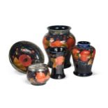 A small group of Moorcroft Pomegranate pattern wares,