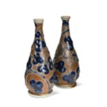 Robert Wallace Martin for Martin Brothers, a pair of stoneware vases, 1876,
