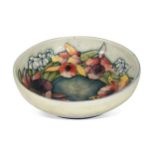 A Moorcroft Orchid pattern bowl,