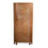 A Heal's limed oak corner cupboard, circa 1930,