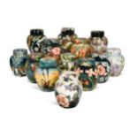 A collection of fourteen modern Moorcroft ginger jars and covers,