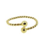 A modern 18ct gold torc bangle,