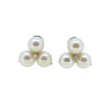 A pair of cultured pearl and diamond ear clips,