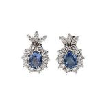 A pair of sapphire and diamond cluster ear pendants,