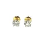 A pair of single stone diamond ear studs,