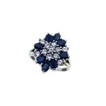 A late 20th century sapphire and diamond cluster ring,